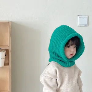 Cozy green knitted kids balaclava hood with integrated neck warmer and ear protection