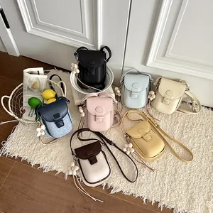 Collection of stylish vertical crossbody phone bags in multiple vibrant summer colors