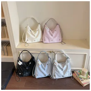 Detailed shot of five versatile large capacity hobo bags in various pastel colors