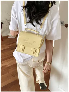 Sweet preppy style yellow mini backpack for girls with cute heart and star prints