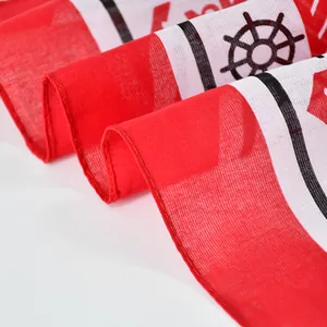 Red and white cotton bandana featuring a classic nautical ship wheel pattern print