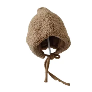 Warm brown sherpa earflap hat with ties for winter comfort and stylish cold protection