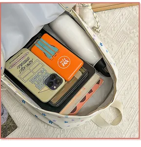 Detailed interior view of star pattern student backpack showing its large storage capacity.