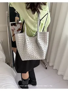 Silver woven tote bag for women featuring large capacity and elegant vintage style