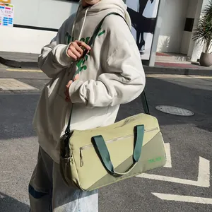 Lifestyle photo of a green leisure shoulder bag with dark green accents and straps