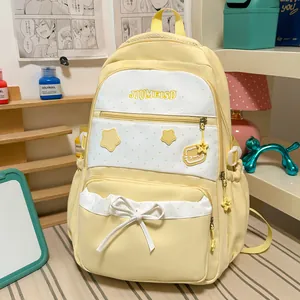 Cute yellow and white student backpack featuring star prints and decorative bow detail
