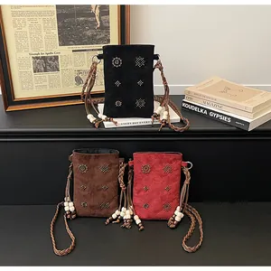 Retro bohemian suede crossbody phone bags with studded details and braided straps