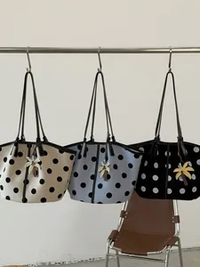 Stylish polka dot canvas tote bags for women featuring decorative palm tree bag charms