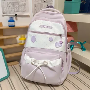 Cute lavender school backpack featuring star prints and a stylish white decorative bow detail