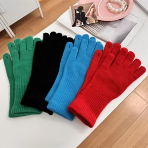 Warm and cozy colorful knitted touchscreen gloves available in green, black, blue, and red colors.
