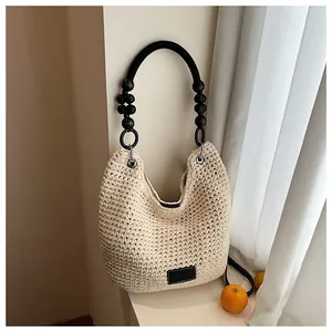 Chic cream crochet bucket bag with a decorative black wooden bead handle for women