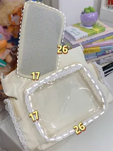 White lace ita bag with large transparent window and 26x17cm dimensions detail