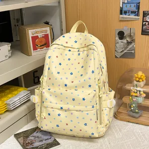 Cute yellow student backpack with colorful star pattern in a cozy lifestyle room