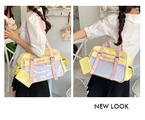 Japanese style cute pink and yellow ita bag with a clear display window shown being worn by a model