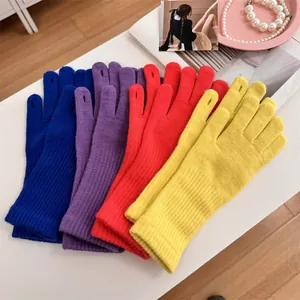 Detailed view of vibrant multi-colored knitted gloves with touch-screen finger openings