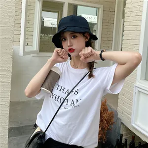 Detail view of a black women's bucket hat with a pleated brim in a casual setting