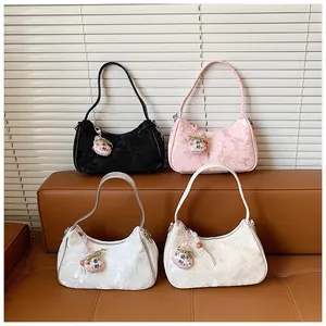 Detailed view of lace butterfly pattern shoulder bags presented in four elegant colors.