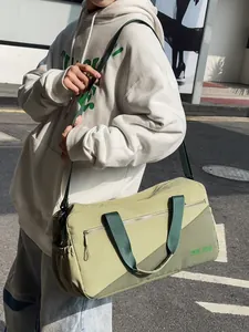 Stylish olive green nylon gym and travel bag for women worn by model outdoors