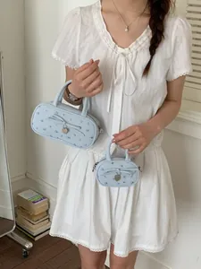 Sweet light blue floral bowling handbag with heart charm available in two sizes