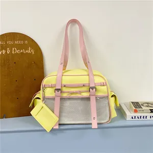 Detailed view of yellow and pink Japanese style kawaii tote bag with mesh pocket and card holder