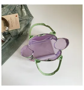 Close-up interior view showing the stylish green and purple transparent mesh bucket bag details