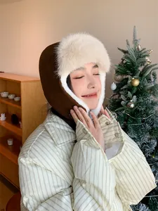 Asian woman wearing a stylish brown plush trapper hat in a cozy winter setting