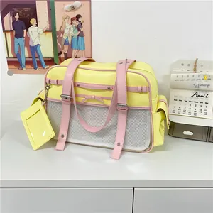 Japanese style anime school tote bag in yellow and pink with mesh pocket and ribbon