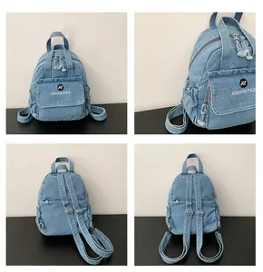 Detaillierte Ansicht eines blauen Denim-Rucksacks für Damen mit AST-Logo und Vordertasche