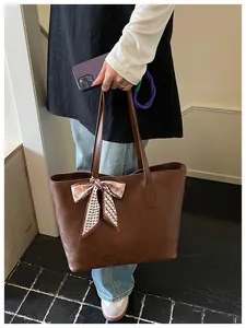 Brown large capacity tote bag with embossed diamond pattern and elegant silk scarf detail