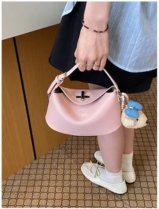 Elegant Korean style pink textured leather bucket handbag with cute teddy bear charm