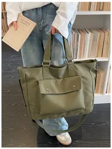 Casual large olive green travel tote bag for women shown in a daily lifestyle setting