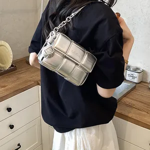 Minimalist silver woven crossbody bag with chain strap for women, stylish niche design.