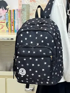 Detailed view of stylish black school backpack with white star pattern and pocket