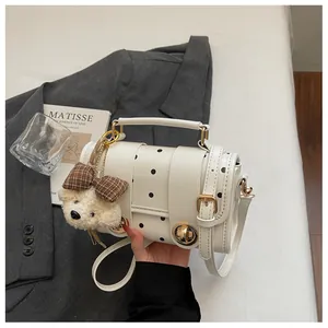 Vintage white polka dot crossbody handbag with cute bear charm and gold hardware detail