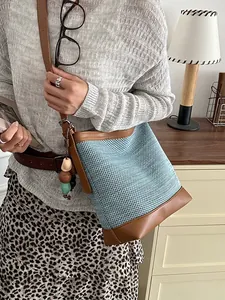 Stylish summer blue mesh bucket bag with brown leather trim and colorful beads