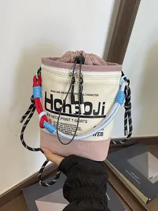 Trendige cremefarbene Beuteltasche mit Grafikdruck und buntem Seilgriff Umhängetasche