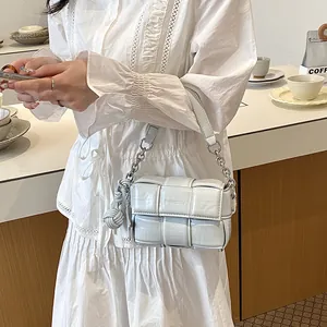 Elegant light gray padded woven shoulder bag with silver chain and a knot charm detail