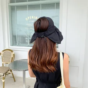 Back view of a black wide brim sun visor hat for women's summer sun protection