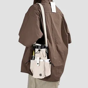 Mini sac bandoulière fonctionnel pour femme avec compartiments pour bouteille et téléphone