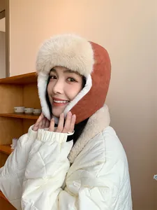 Close-up of a cozy corduroy winter Lei Feng hat with plush faux fur ear protection