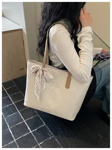Large cream commuter tote bag with embossed diamond pattern and decorative scarf detail