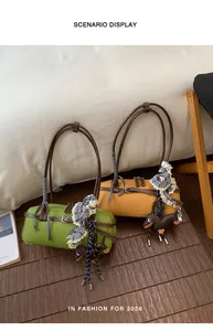 Stylish green and yellow Boston bags displayed in a cozy indoor lifestyle scenario