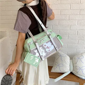 Japanese style cute mint green ita bag shown in a lifestyle indoor scene with model