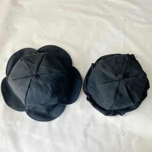 Detailed top view of a black Japanese style fisherman hat featuring a lotus leaf pleated brim