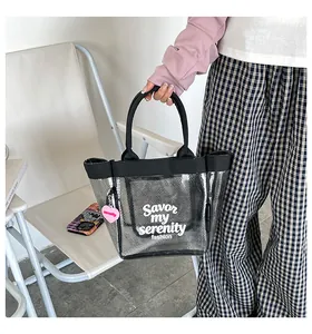 Stylish transparent mesh bucket bag with 'Savor my serenity' slogan and heart charm