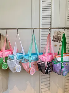 Trendy colorful transparent mesh tote bags with matching coin pouches hanging on a rack.