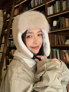 Warm winter plush trapper hat for women with cozy faux fur lining and ear flaps