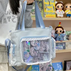 Large light blue ita bag with delicate white lace trim and transparent front display pocket