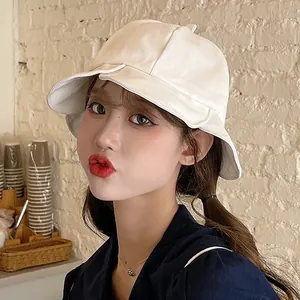 Elegant Japanese style white bucket hat featuring ruffled edge for summer sun protection