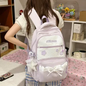 Rear view of a lavender cute school backpack with white bow and star charms